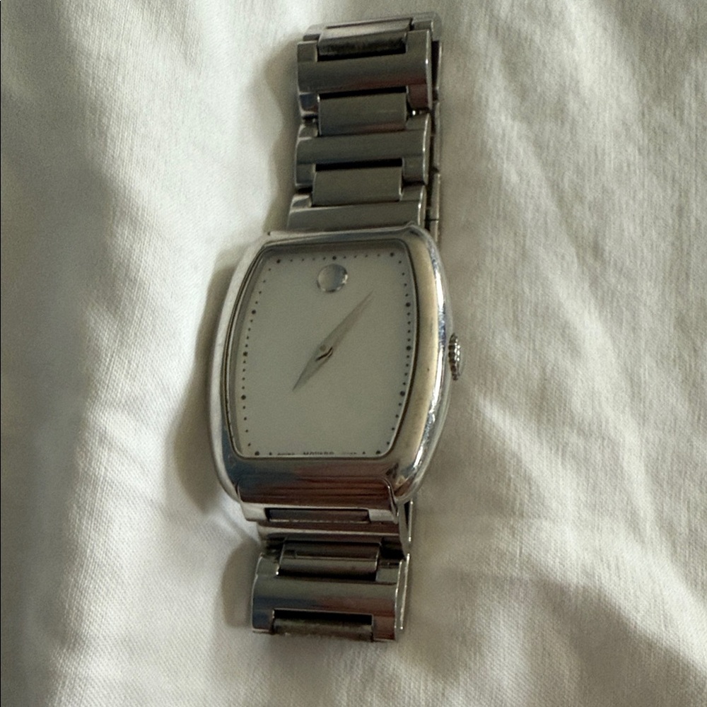 Women’s Movado Silver Watch with mother of pearl face. Will need new battery.
